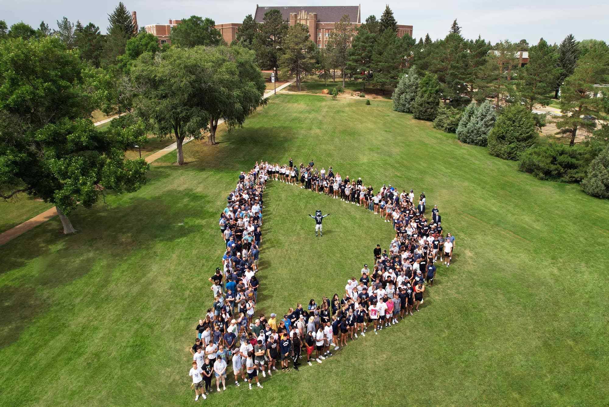 Aerial shot of DSU Students on campus forming the letter D