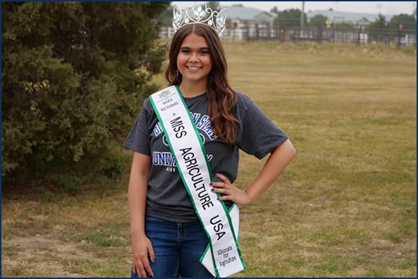 college girl in crown and sash