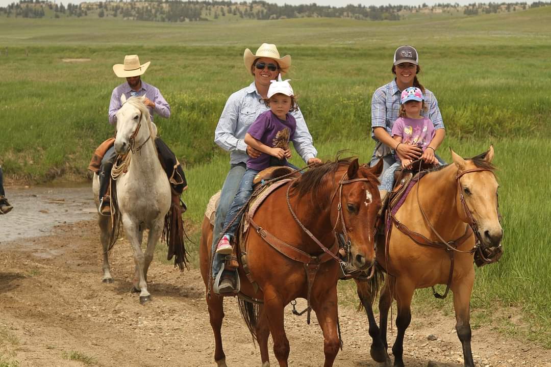 Heather and Hannah Labree riding on the ranch with friends and family. 