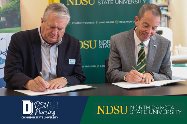 President Molander and President Stewart signing photo